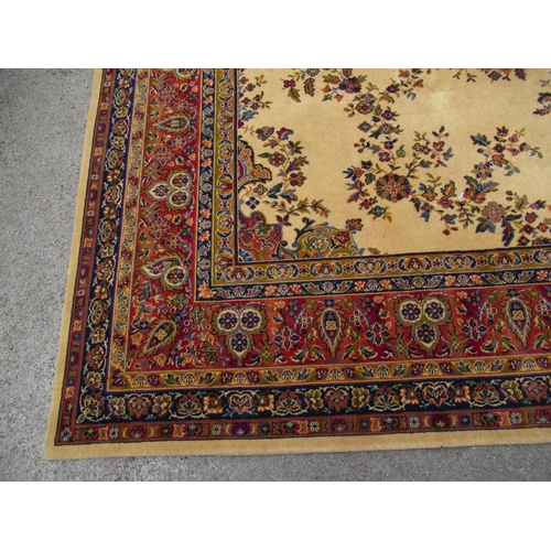 1 - Wilton type machine woven carpet with a medallion and floral design on a beige ground with borders, ... 