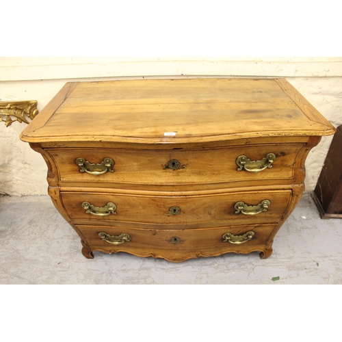 1253 - Antique Continental fruitwood bombe shaped commode chest, the moulded top above three long drawers w... 