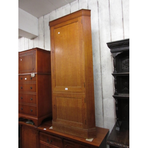 1258 - Heals oak standing corner cabinet, the moulded cornice above two panelled doors, 28ins x 62ins, labe... 
