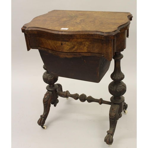 1525 - Victorian figured walnut games / work table, the shaped fold-over swivel top enclosing chess, backga... 