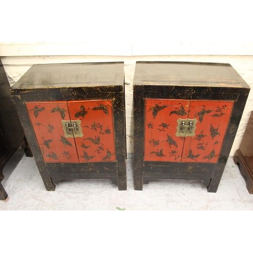 1552 - Pair of late 19th / early 20th Century Chinese red and black lacquer two door side cabinets, the ext... 
