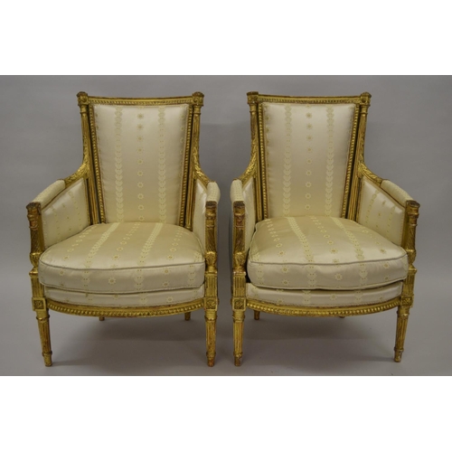 1562 - Pair of good quality 19th Century French giltwood armchairs, the shaped backs with reeded uprights a... 