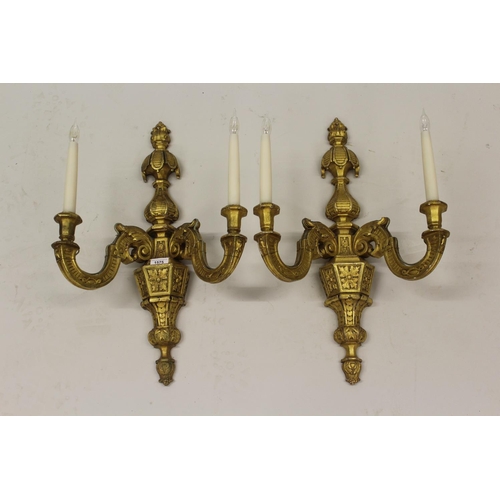 1575 - Pair of 19th Century carved and gilded composition twin light wall sconces of faceted baluster form,... 