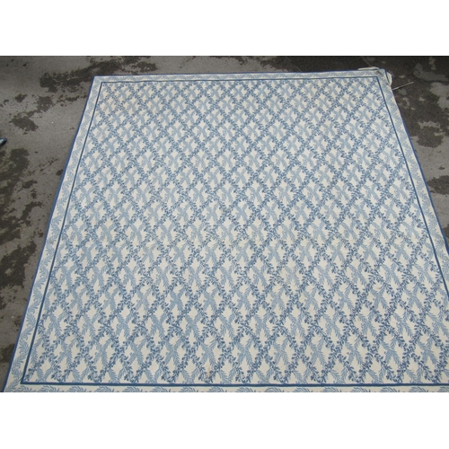 7 - Large modern Chinese machine woven carpet with an all-over blue floral lattice design on an ivory gr... 