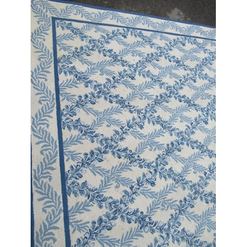 8 - Large modern Chinese machine woven carpet with an all-over blue floral lattice design on an ivory gr... 