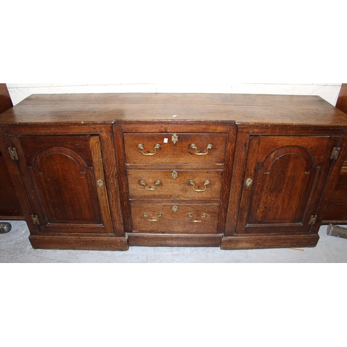 1652 - 18th Century oak inverted breakfront dresser base, the three centre drawers with brass handles flank... 