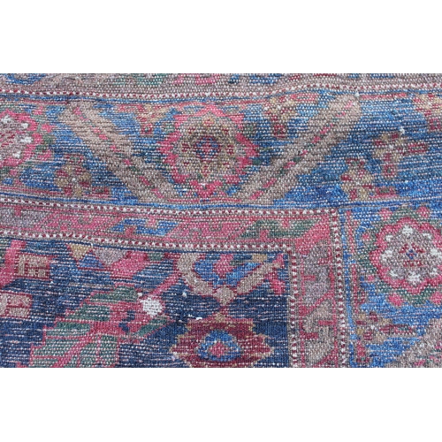 26 - Antique Kurdish rug, having all over stylised floral design, midnight ground with multiple borders, ... 