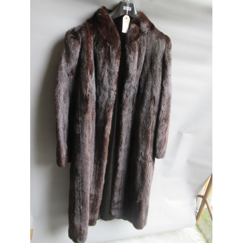 37 - Ladies dark brown three quarter length mink fur coat together with a similar mid tan jacket
