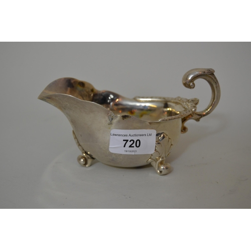 720 - Victorian silver helmet shaped cream jug with C-scroll handle, makers mark for Garrards (marks rubbe... 