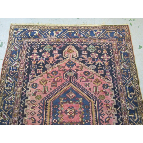 19 - Shiraz carpet with a triple pole medallion and all-over stylised design on a red ground with multipl... 