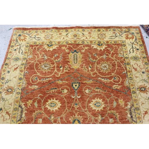 33 - Kurdish rug with centre medallion and all-over floral design on a dark red ground with borders, appr... 