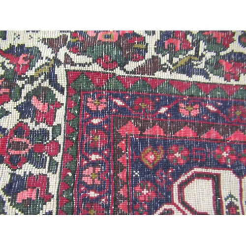 15 - Modern Qashqai carpet with a medallion and all over stylised floral design on a deep red ground with... 