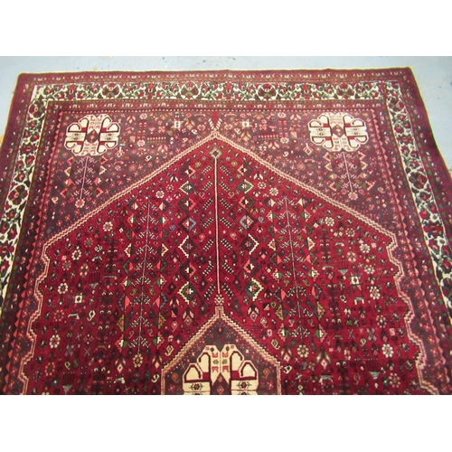 15 - Modern Qashqai carpet with a medallion and all over stylised floral design on a deep red ground with... 