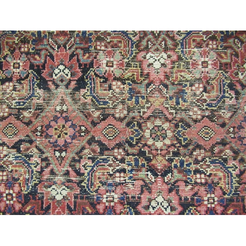 16 - Antique Ferahan carpet with all over Herati design on a dark ground, with multiple borders, (some we... 