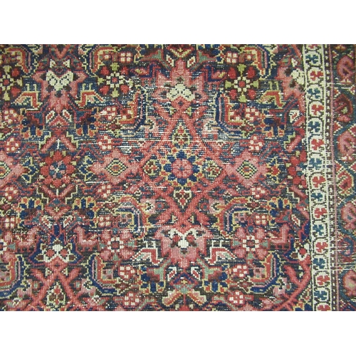 16 - Antique Ferahan carpet with all over Herati design on a dark ground, with multiple borders, (some we... 
