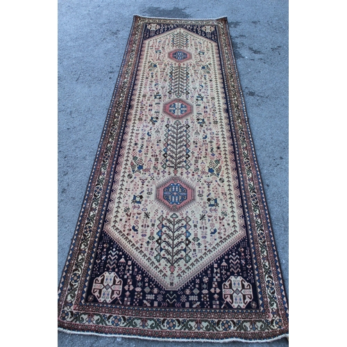 2 - Abadeh runner with a medallion and all-over design on a blue ground with borders, 3.1m x 95cms appro... 