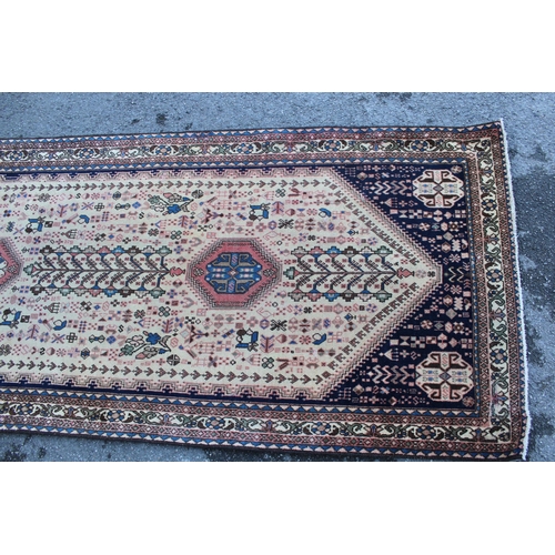 2 - Abadeh runner with a medallion and all-over design on a blue ground with borders, 3.1m x 95cms appro... 