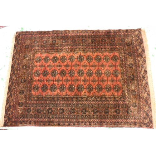 31 - Modern Turkoman rug with three rows of ten gols on a wine ground, with multiple border, 6ft x 4ft 4i... 