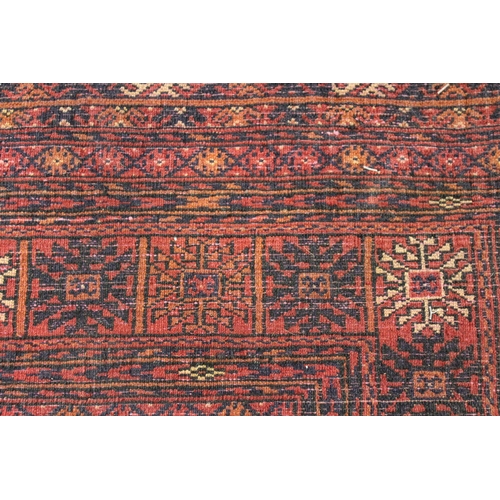 31 - Modern Turkoman rug with three rows of ten gols on a wine ground, with multiple border, 6ft x 4ft 4i... 