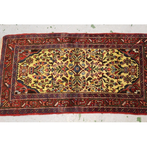 36 - Small Saruq rug with an all over stylised floral design, on a pale yellow ground with borders, 4ft 4... 