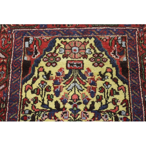 36 - Small Saruq rug with an all over stylised floral design, on a pale yellow ground with borders, 4ft 4... 