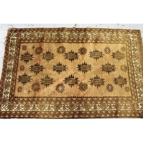 42 - Small Afghan rug with an all over stylised floral design, in shades of beige and brown, 5ft4ins x 3f... 