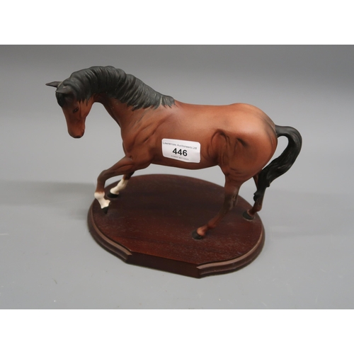 446 - Royal Doulton bisque figure of a horse, on an oval wooden base