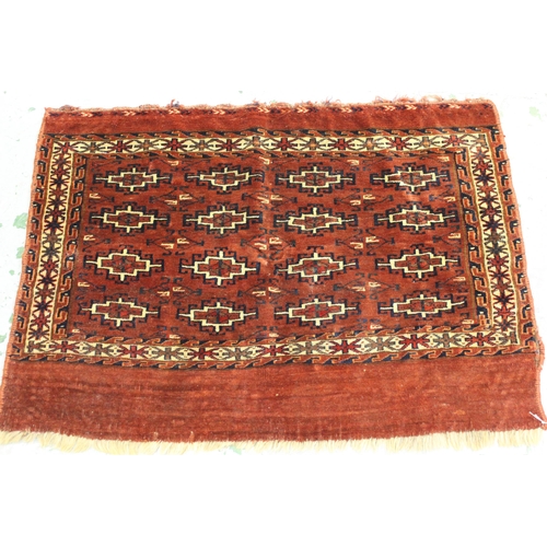 48 - Small Turkoman tent bag with four rows of four gols, on a madder ground with skirt panel, 3ft 4ins x... 