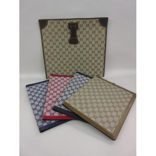 70 - Four Gucci stationery folders and a similar case