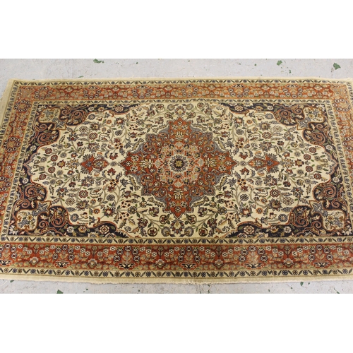 8 - Small Indo-Persian rug with centre medallion and all over floral design, with multiple borders, (wor... 