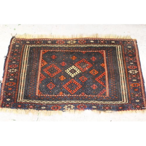 9 - Small Belouch rug of geometric design with multiple borders, 24ins x 41ins together with another, 32... 