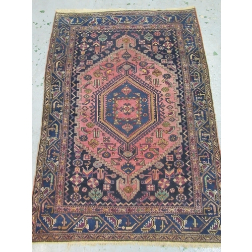 19 - Hamadan rug with a lobed hooked medallion and all over stylised design on a rose ground with blue gr... 