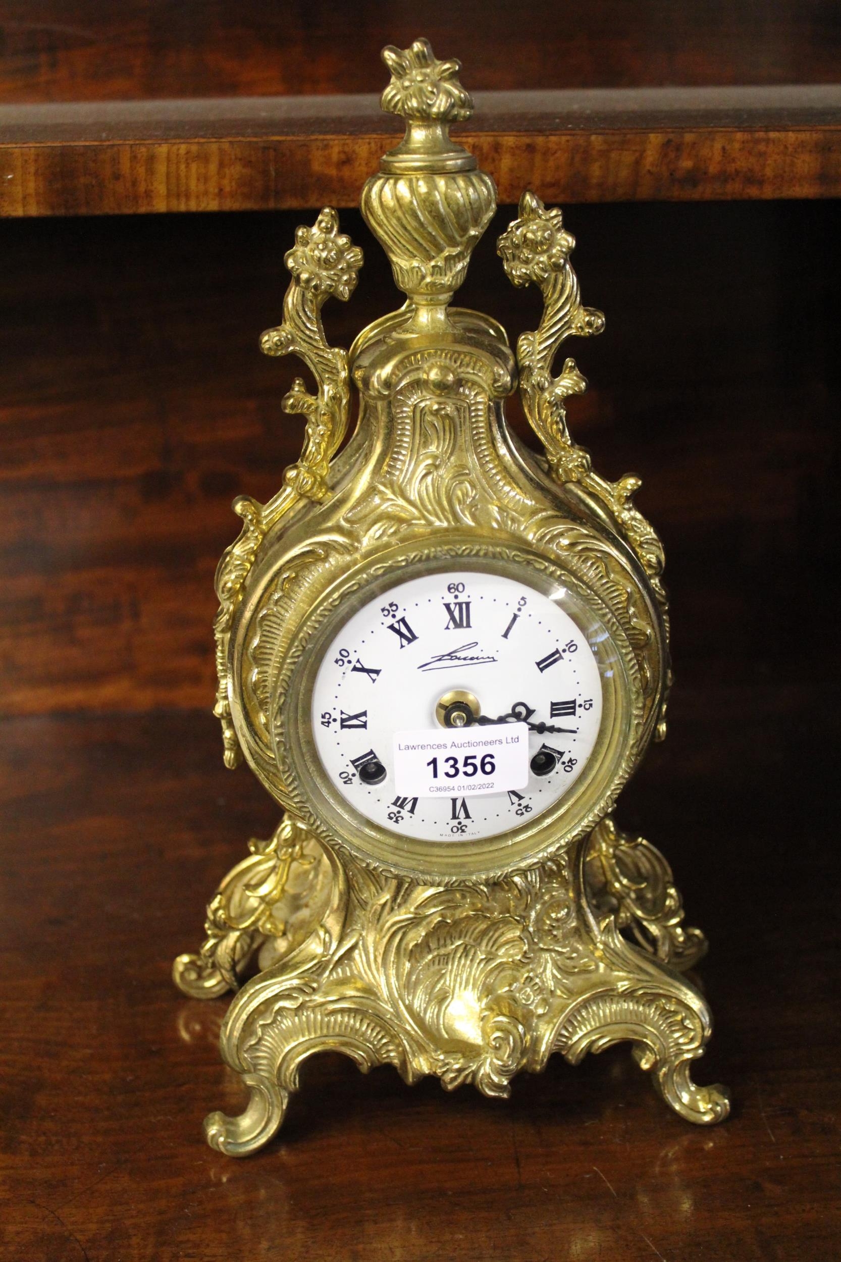 Reproduction brass mantel clock, the - auctions & price archive