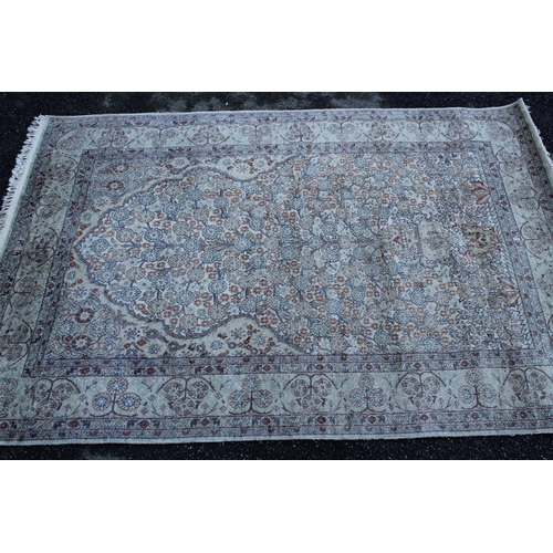 16 - Cotton prayer rug of Persian vase design in pastel shades, 6ft 2ins x 4ft approximately (some wear)