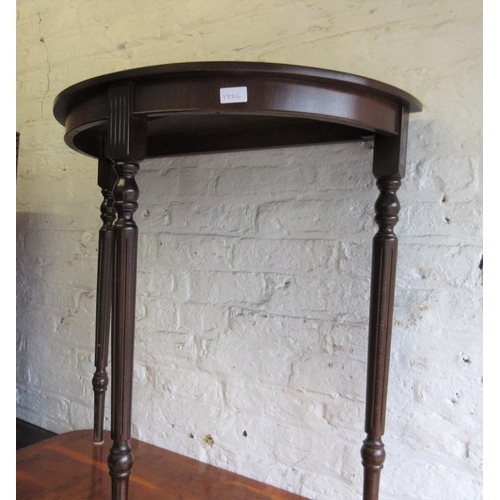1886 - Reproduction leather inset mahogany half round hall table, together with a nest of three reproductio... 