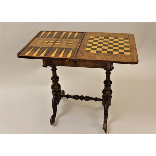 1910 - Victorian figured walnut games / work table (lacking wool compartment), on turned end supports with ... 