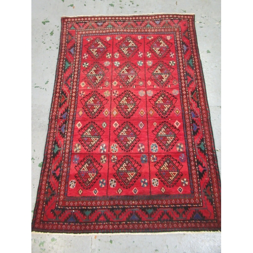 2 - Modern Belouch style rug with an all over hooked medallion and panel design on a red ground with rec... 