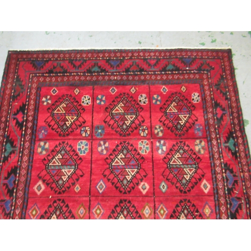2 - Modern Belouch style rug with an all over hooked medallion and panel design on a red ground with rec... 