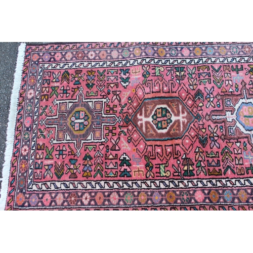 29 - 20th Century Karaja runner with repeating hooked medallion design and borders, 8ft x 2.5ft approxima... 