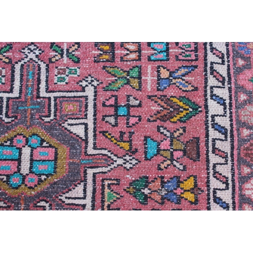 29 - 20th Century Karaja runner with repeating hooked medallion design and borders, 8ft x 2.5ft approxima... 
