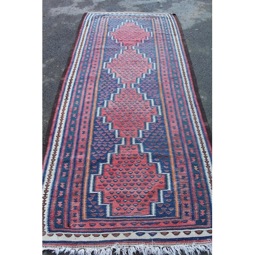 30 - Kelim rug with four medallion design, 9ft 6ins x 4ft 4ins