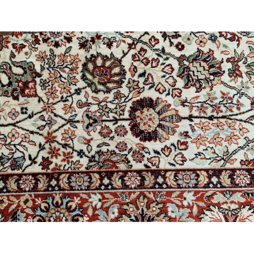 33 - Machine woven carpet of Persian design with an all-over stylised palmette and flower head pattern on... 