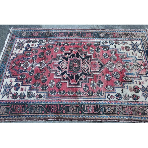41 - Hamadan rug with a lobed medallion design on a rose ground with cream corner designs and borders, 5f... 