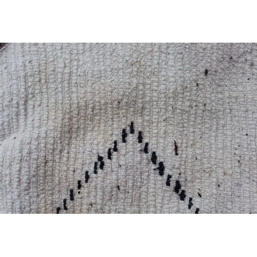 42A - Berber carpet with dark lattice design on cream ground, 7ft x 4ft 10ins approximately