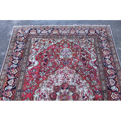 7 - Tabriz rug with a lobed medallion and all-over floral design on a rose ground with multiple borders,... 