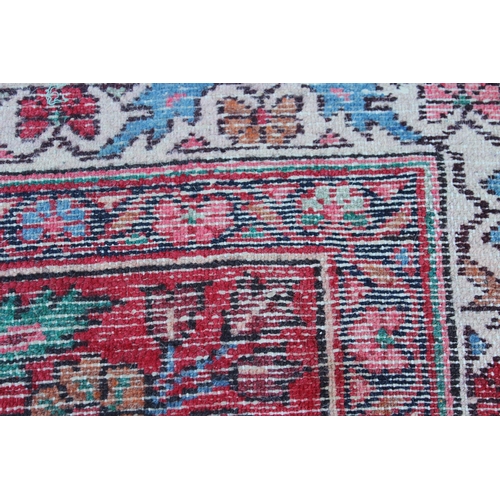 8 - Sarouk runner with a typical all-over floral design on a red ground with border, 17ft 8ins x 3ft 6in... 