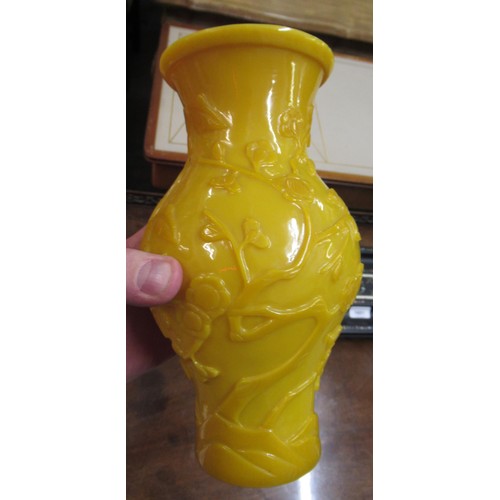 428 - Chinese yellow Peking glass baluster form vase decorated in relief with prunus blossom, unmarked, 8.... 