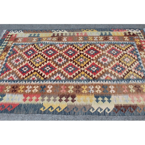 2 - Kelim rug with an all-over stylised polychrome flower head design and triple borders, 8ft x 5ft 3ins... 