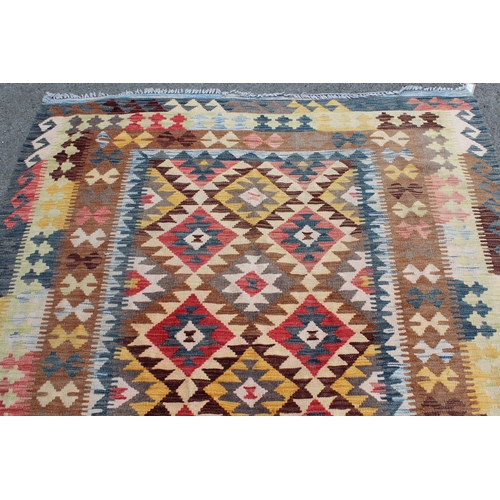 2 - Kelim rug with an all-over stylised polychrome flower head design and triple borders, 8ft x 5ft 3ins... 