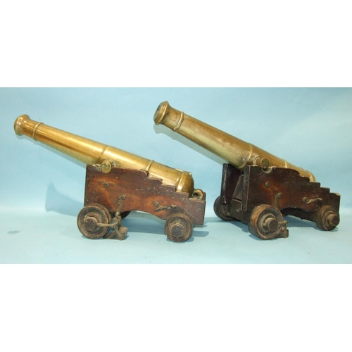 870 - An unusual pair of bronze signalling canons, each 55cm barrel with Victorian cipher, supported by a ... 